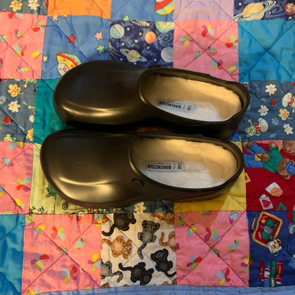 Black Birkenstock clogs with shearling.